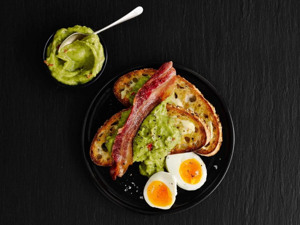 a plate of breakfast food with eggs bacon and toast at ibis Glasgow City Centre – Sauchiehall St in Glasgow
