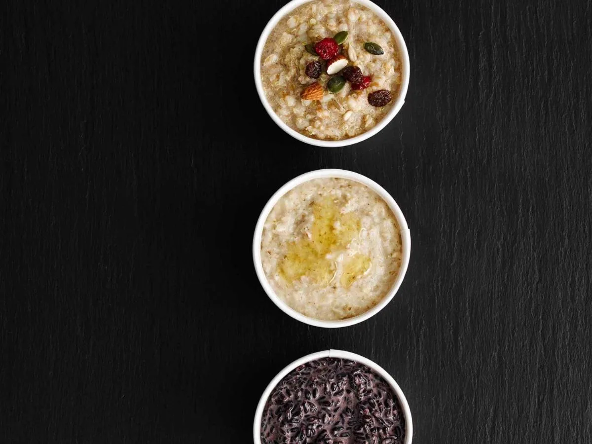 three bowls of oatmeal with berries and other food additives at ibis Glasgow City Centre – Sauchiehall St in Glasgow