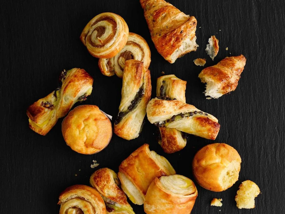 a group of pastries and croissants on a table at ibis Glasgow City Centre – Sauchiehall St in Glasgow